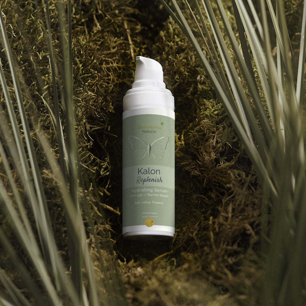 Kalon Replenish Skincare bottle on a natural background with grass and moss