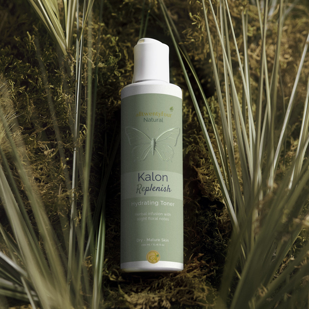 Kalon Skincare Hydrating Toner bottle surrounded by grass and plants