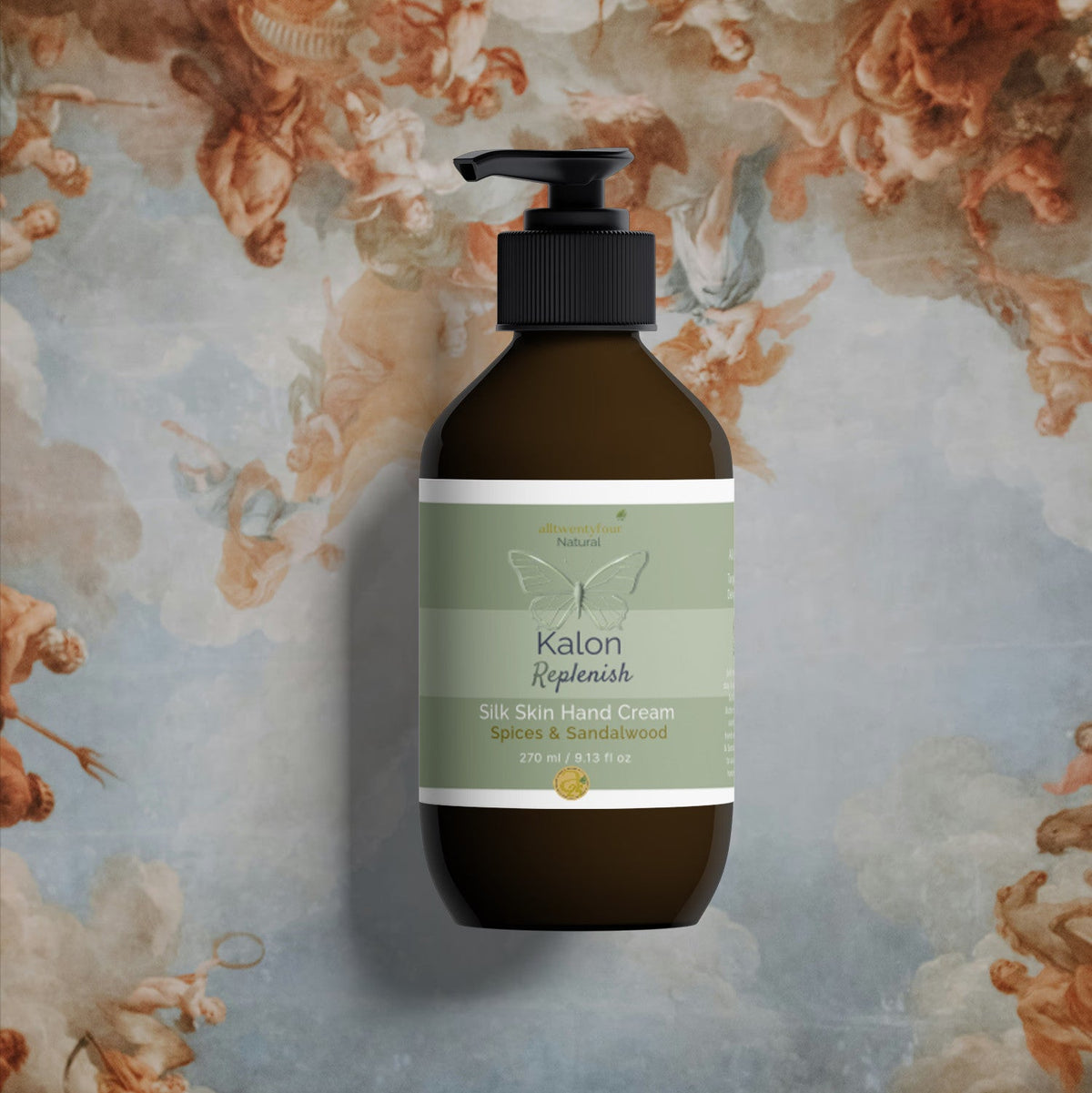 A bottle of Kalon Silk Skin Hand Cream centered against a classical fresco background depicting winged figures and clouds.
