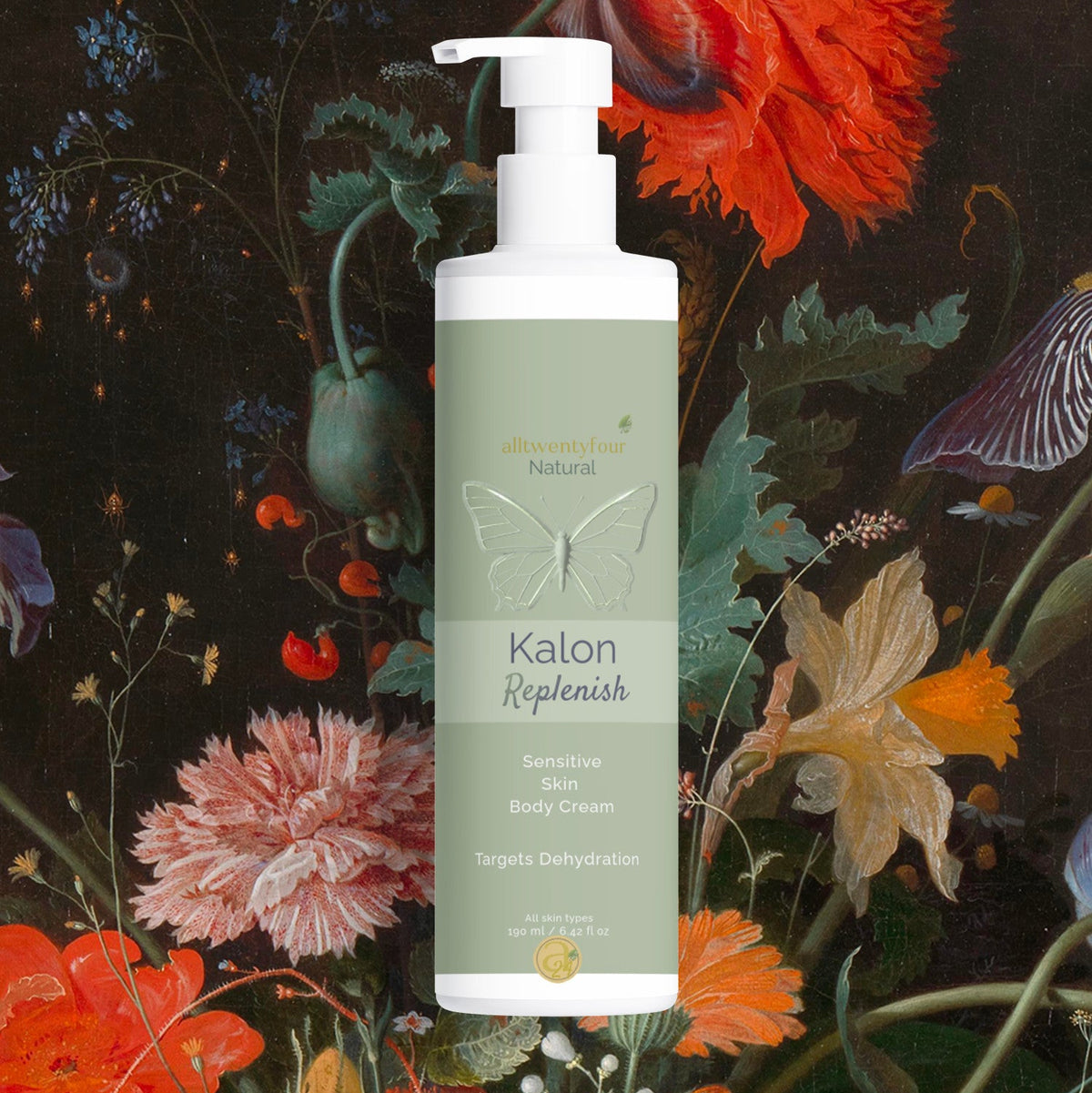 A bottle of Kalon Replenish Sensitive & Dry Body Cream centered against a dark, ornate floral background featuring red poppies, pink flowers, and green foliage.