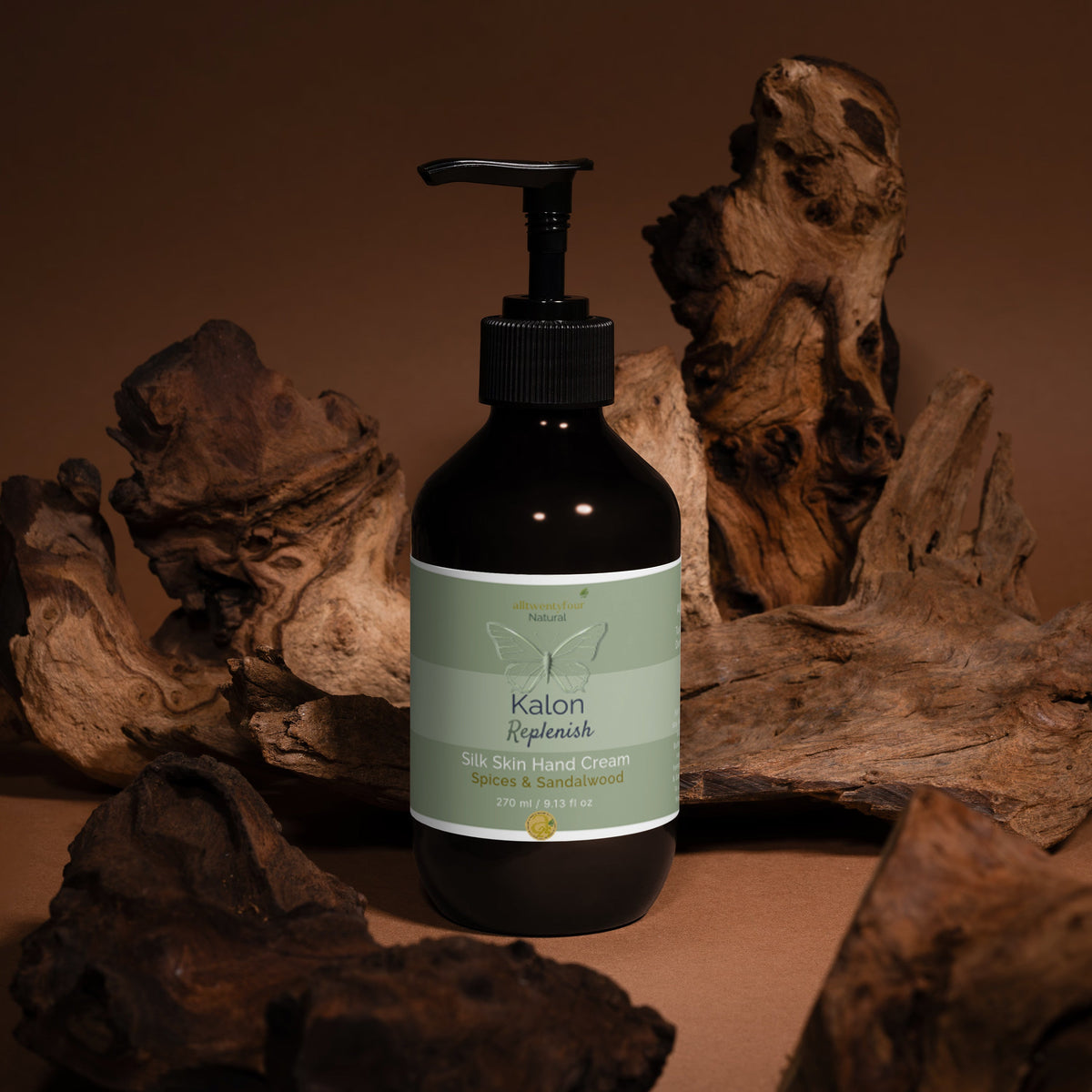 Bottle of Kalon skin Hand cream with a pump on a wooden surface